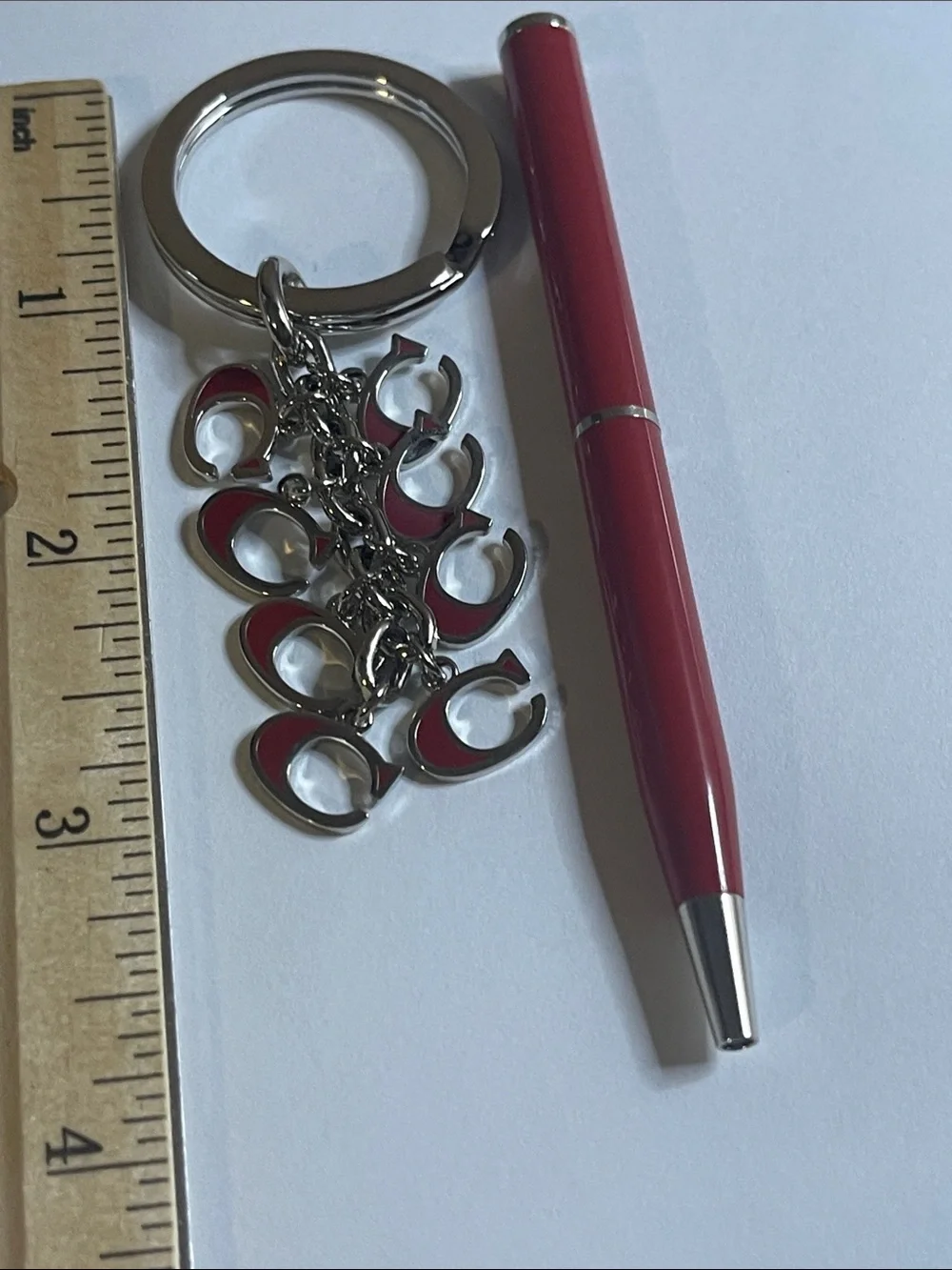 Coach Silver-Tone Keyring with Red Enamel 'C' Charms and Coach Pen